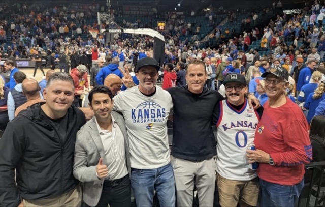 Partners courtside at the game